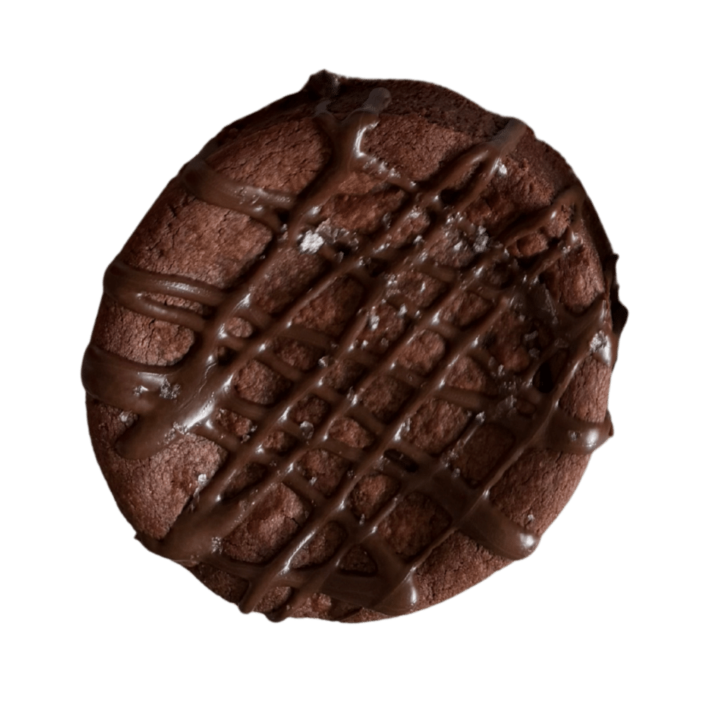 Gluten-Free Sea Salt Double Chocolate Cookie A thick, gourmet gluten-free double chocolate cookie with a dense fudgy texture, finished with a chocolate drizzle and a light dusting of sea salt.