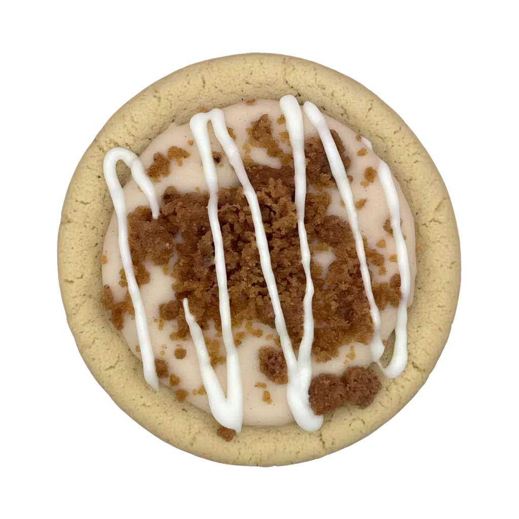Gluten-free brown butter cinnamon cookie filled with a brown sugar swirl, topped with vanilla glaze and cinnamon crunch streusel.