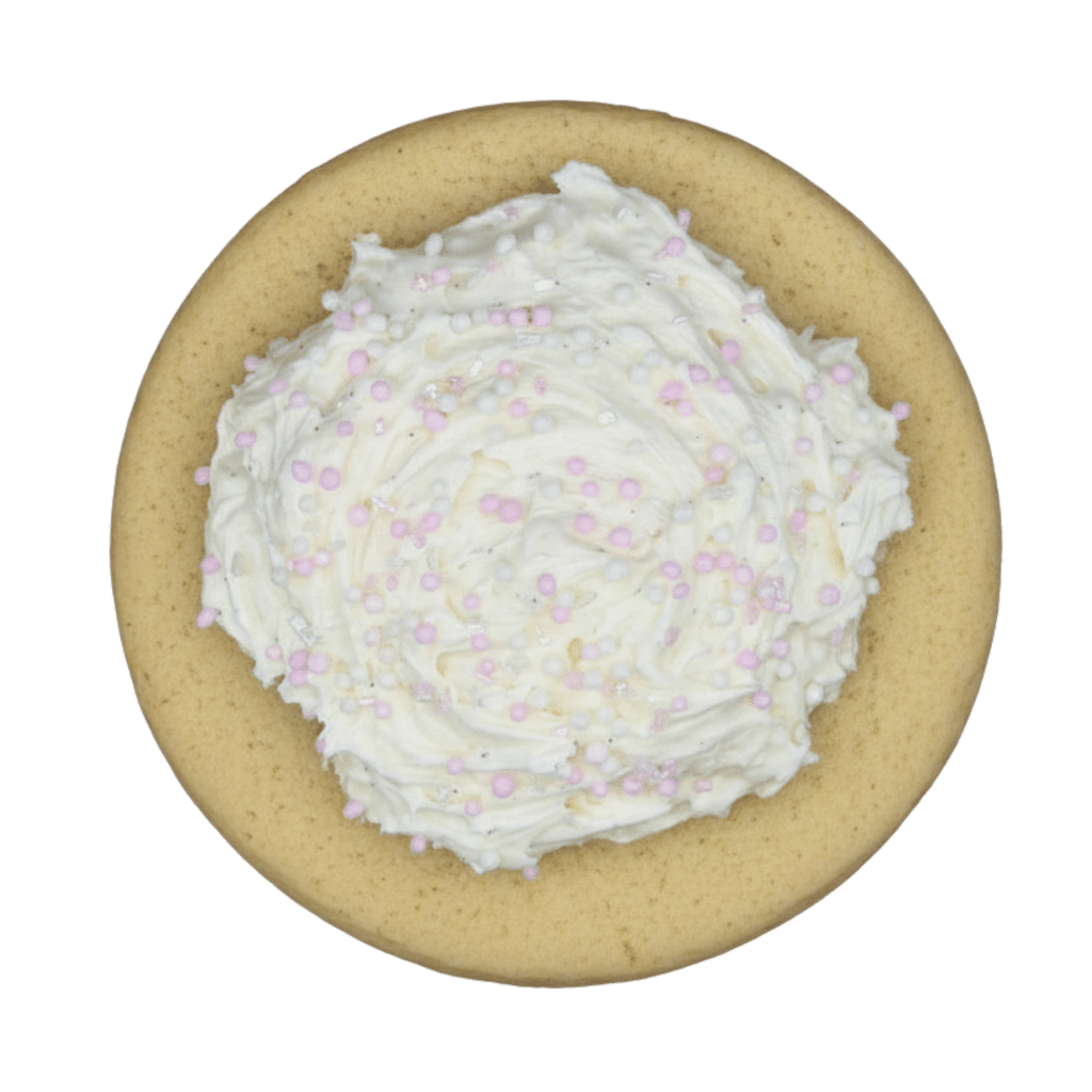 A soft, gluten-free vanilla bean cookie finished with a tall, smooth swirl of white buttercream frosting.